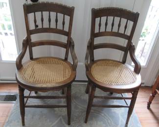 Cane bottom kitchen or dining chairs. Early 1900s.