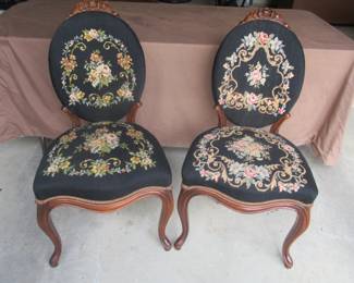 Needle point Victorian side chairs. Carved roses at top of each chair. 