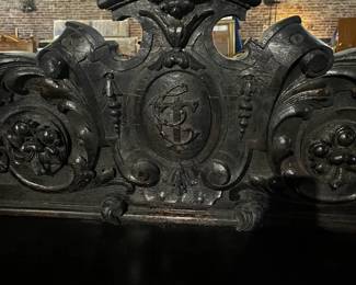 19th Century Italian Renaissance Revival Ebonized Sideboard with Monogrammed Cartouche Shield Crest - Approximately 76.25" High x 68.25" Wide x 22.75" Deep. 