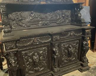19th Century Italian Renaissance Revival Ebonized Sideboard with Monogrammed Cartouche Shield Crest - Approximately 76.25" High x 68.25" Wide x 22.75" Deep. 