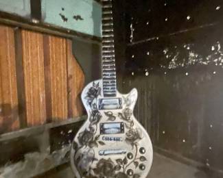 HUGE - Homage to Mickey Cohen Gibson Guitar Art Piece by Mark Mahoney - Signed by Artist.  Base is inscribed with Sunset Strip and City of West Hollywood California 1984.  It is VERY large and measures 42" x 116".  The Base is 43.5" x 33.5".