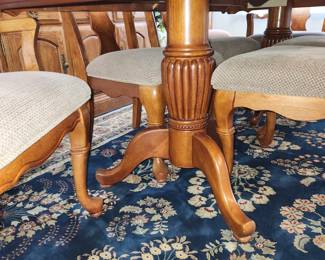 Table measures: 82" long (with one 13" leaf inserted) x 43" wide. Table w/ 2 13" leaves, 8 chairs (2 w/ arms) and pads. Dining table with chairs and china cabinet are AVAILABLE FOR PRE-SALE. Please contact us for pricing.