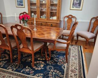 Table measures: 82" long (with one 13" leaf inserted) x 43" wide. Table w/ 2 13" leaves, 8 chairs (2 w/ arms) and pads. Dining table with chairs and china cabinet are AVAILABLE FOR PRE-SALE. Please contact us for pricing.