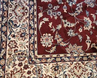 red area rug, 8'8" x 5'6"