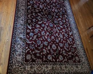 red area rug, 8'8" x 5'6"