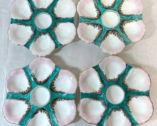 Four Porcelain Oyster Serving Plates
