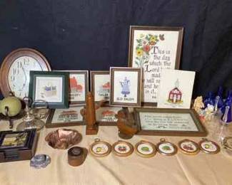 Decor Lot Framed Old Salem Needlepoint Items, Mini Blue Vases, Walnut Wood Figurines, And More. 