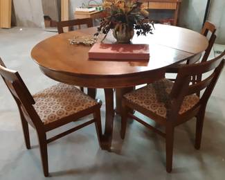Antique oak dining table and chairs in the basement.  