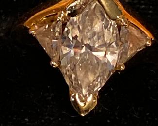 Stunning Marquis Diamond Ring with 2 side triangle diamonds set in gold.  Picture does not show just how brilliant the diamond is! Beautiful!