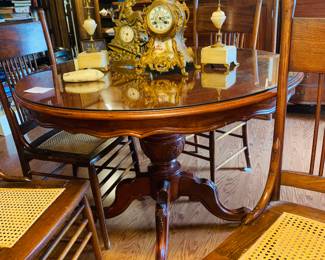 gorgeous round table with four caned chairs