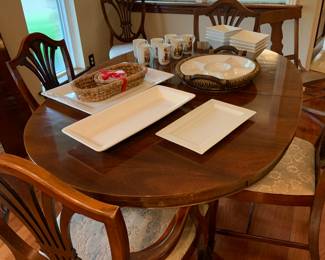 Duncan Phyfe dining room table, and white serving pieces