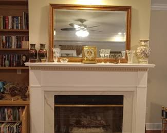 Look for yourself at the books we have for you. Wood framed mirror, mantle clock, vases, 