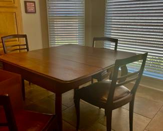 Breakfast table with 6 total chairs & 2 leafs, that is a dining table if needed.
