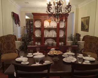Wood dining table with leaf & 6 upholstered chairs, beautiful China cabinet, greenery, amazingly gorgeous China.