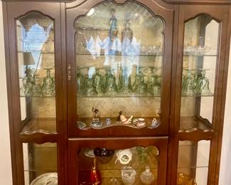 Lovely wood & glass display cabinet filled with collectibles. 