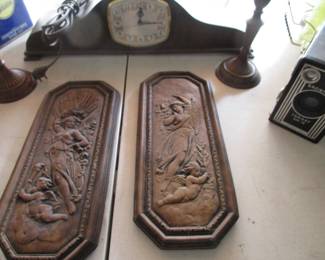 Vintage clock, bronze wall plaques