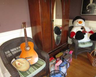 Old wicker chairs, Decca guitar, antique armoire