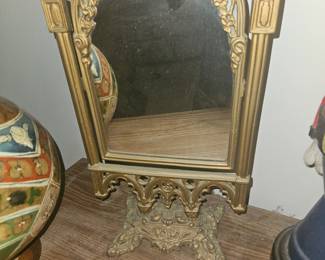 This nice little solid, very heavy. I believe cast iron mirror I hope it doesn't sell because I love it but first $100 gets it