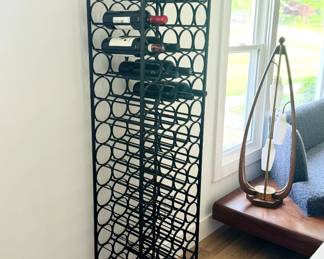 Vintage Midcentury Modern black wrought iron 67 bottle wine rack by Arthur Umanoff for Shaver Howard.