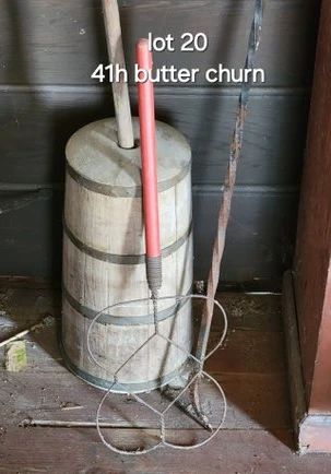 Antique butter churn, rug beater, cast iron poker