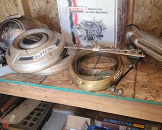Vintage hubcaps and reloading equipment.