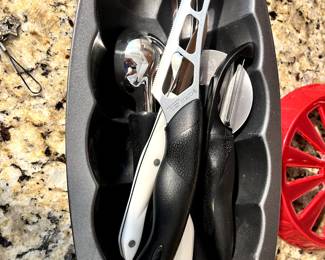 Bunch of Cutco Knives and other kitchen utinsels. 