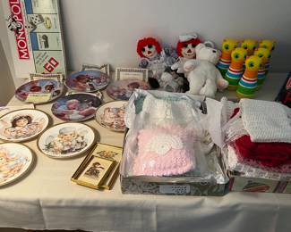 Hand Crocheted Baby Blankets and Outfits NEVER USED (New-In Boxes Kept for Standby Gifts) 
Collectible Doll Plates 
Monopoly 