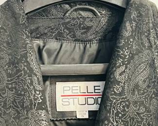 Pelle Studio Long Black 100% Leather Jacket
Petite Small. 50" from the top of the folded collar to the base of the coat. 33.5" from armpit to base of coat. Secure two-snap closure with extra replacements, shown. Fully lined sleeves.