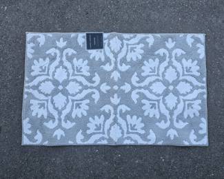 Lot 389 | New Laura Ashley 27×45" All Loop Accent Rug
