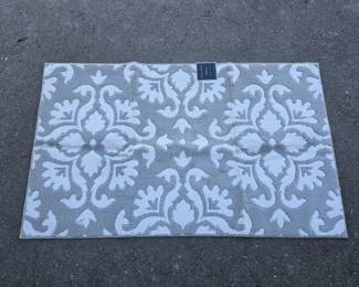 Lot 377 | New Laura Ashley 36×60" All Loop Accent Rug