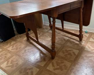 Vintage maple gate leg table with 2 leaves, $150.00.  