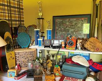 TROPHIES, SKATEBOARDS AND RACKETS