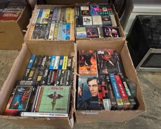 #1106 • 4 Boxes of VHS Cassette Tapes and CDs
