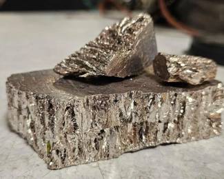 #1630 • 2.5" x 4" Piece of Possible Bismuth and Smaller Pieces, Heavy
