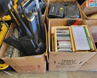 #2522 • Two Boxes of CDs and Metal Rack
