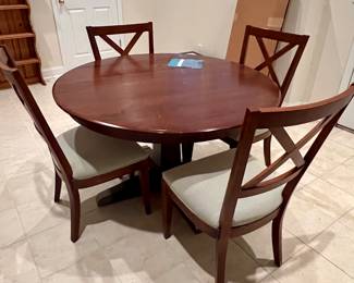 Ethan Allen round dining table with extra leaf and 4 chairs