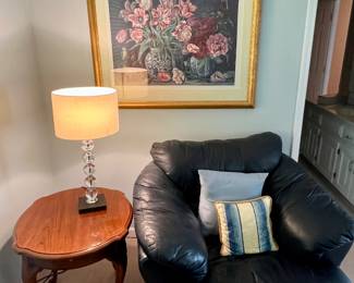 Oversized navy blue leather chair and ottoman. The ottoman has a top seam rip that can be fixed easily if you sew.