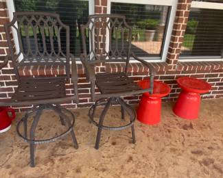 Bar stools and small red tables