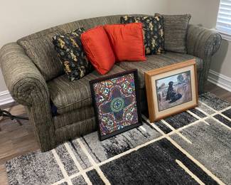 Love seat and art work 
Cool rug