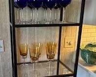 Room and Board tall shelving unit with tempered glass shelves