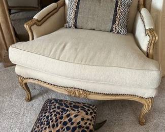 Duralee Fine Furniture French Country accent chair and animal print (fabric)  ottoman with horn legs with nail head detail.