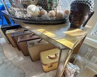 Leather and nail head sofa table, vintage suitcases