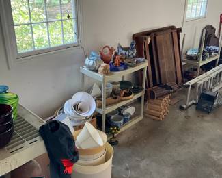 LAMP SHADES AND POTS IN A GARAGE READY FOR PICKING