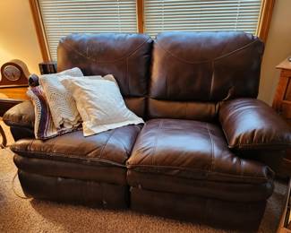 Leather loveseat, fair condition. 