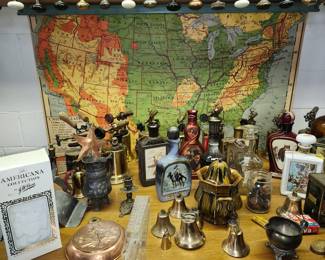 Decanters, bells, vintage pull down map. 