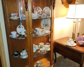 Bowfront Curio, Teacups. 
