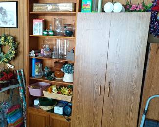 Another bookshelf, vases and storage shelf with doors