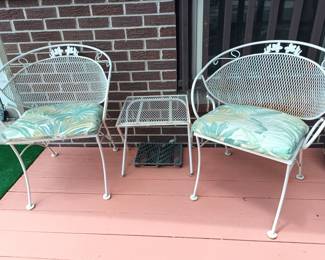 Wrought iron patio chairs and table.   I KNOW!   There are a lot of them!