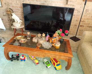Glass top table, flat screen tv and various things to trip on