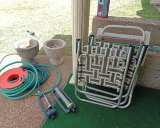Folding patio chairs, hose, sprinklers and cement pots